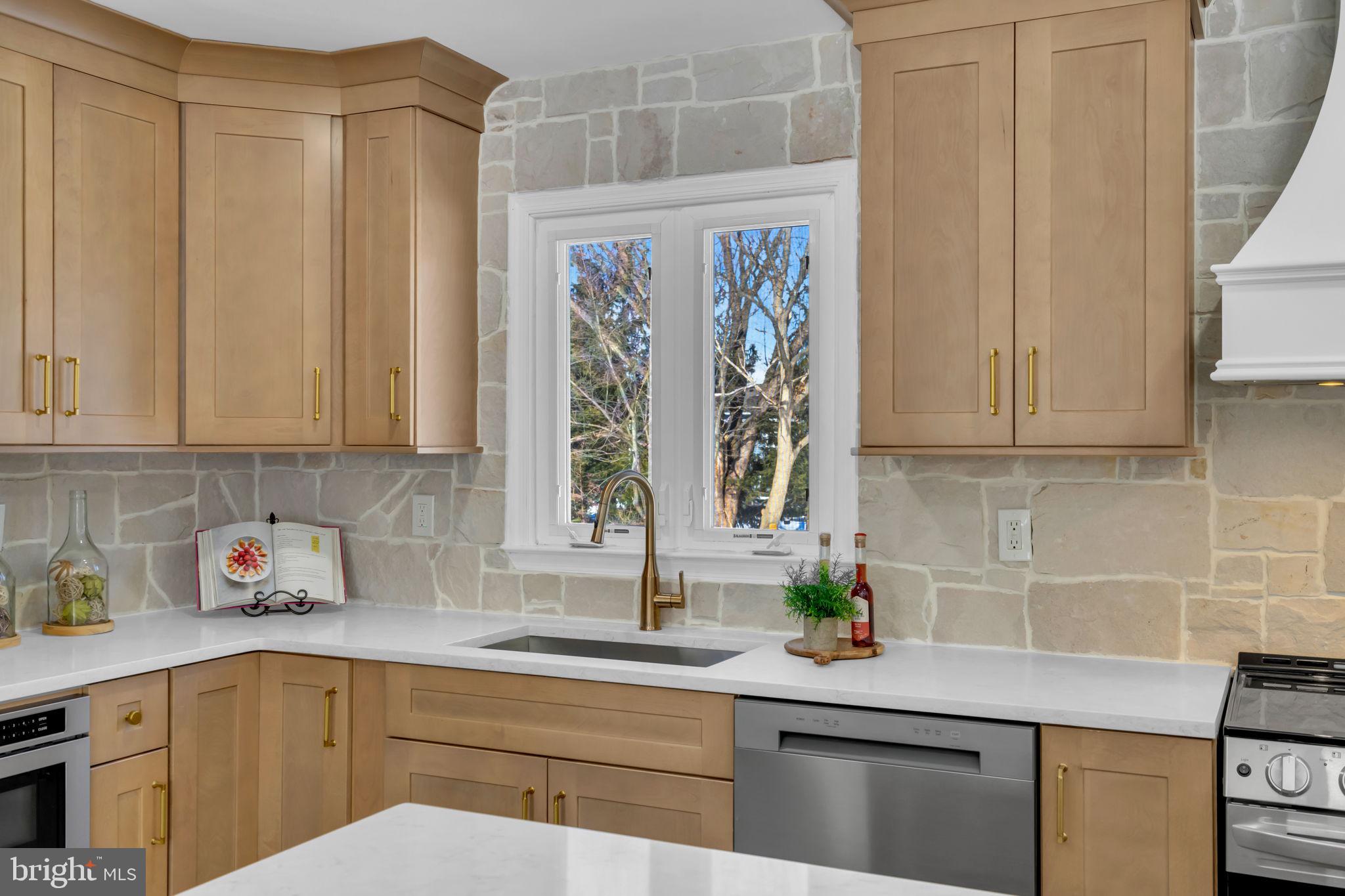 568 Flock Road Trenton, NJ 08690 - Photo 16 of 42 a kitchen with stainless steel appliances a sink a counter and cabinets