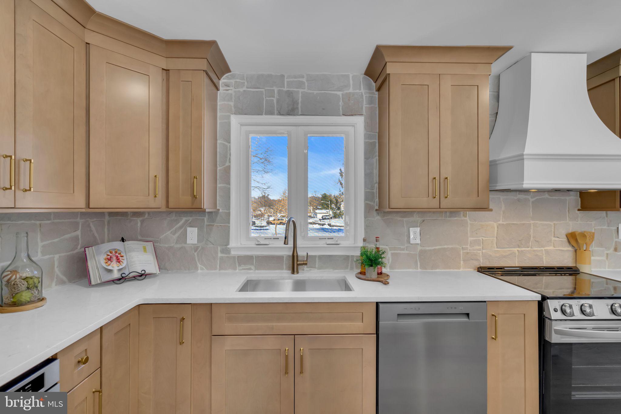 568 Flock Road Trenton, NJ 08690 - Photo 19 of 42 a kitchen with stainless steel appliances granite countertop a sink a stove and cabinets