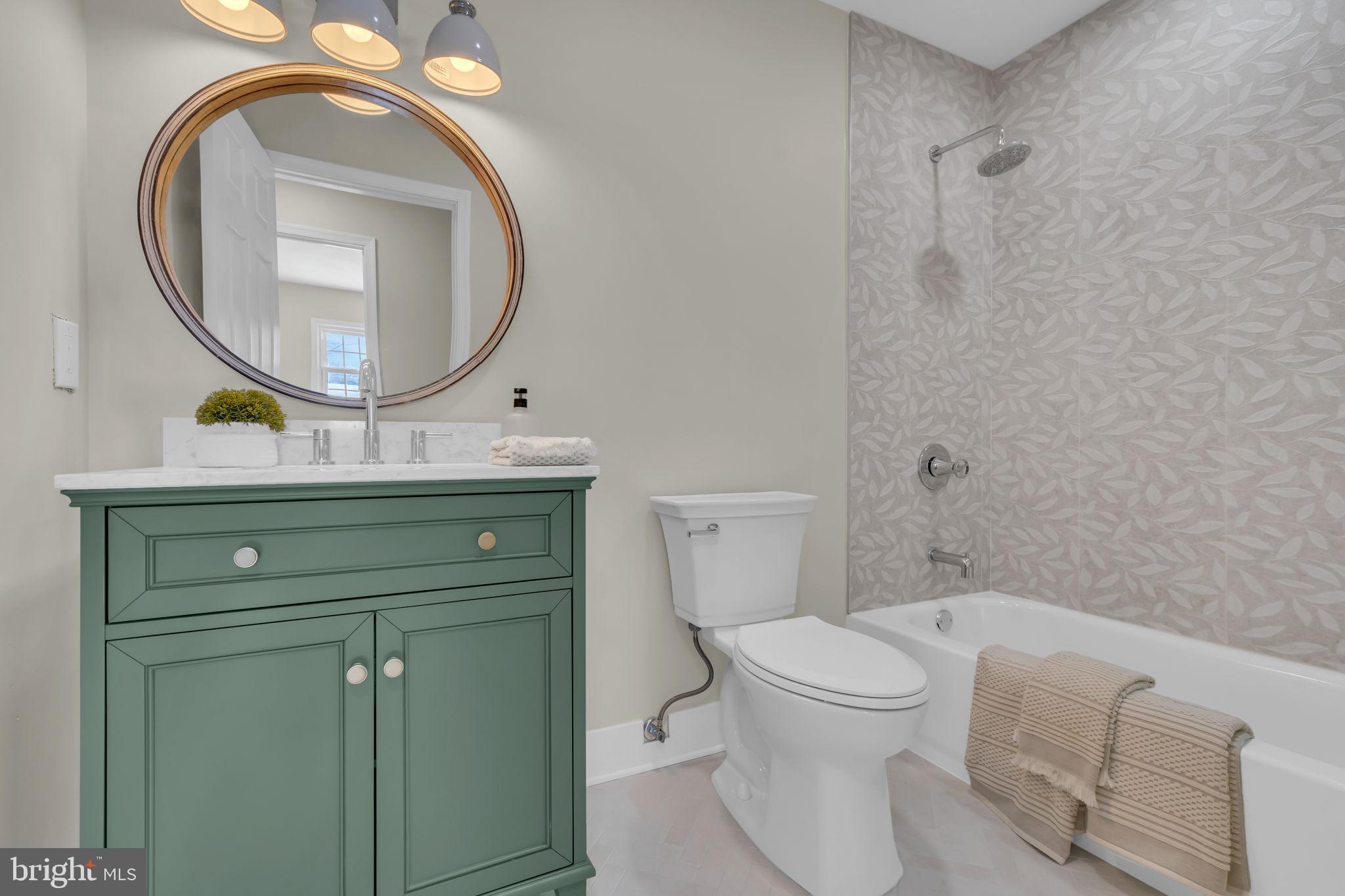 568 Flock Road Trenton, NJ 08690 - Photo 23 of 42 a bathroom with a toilet a sink and a mirror