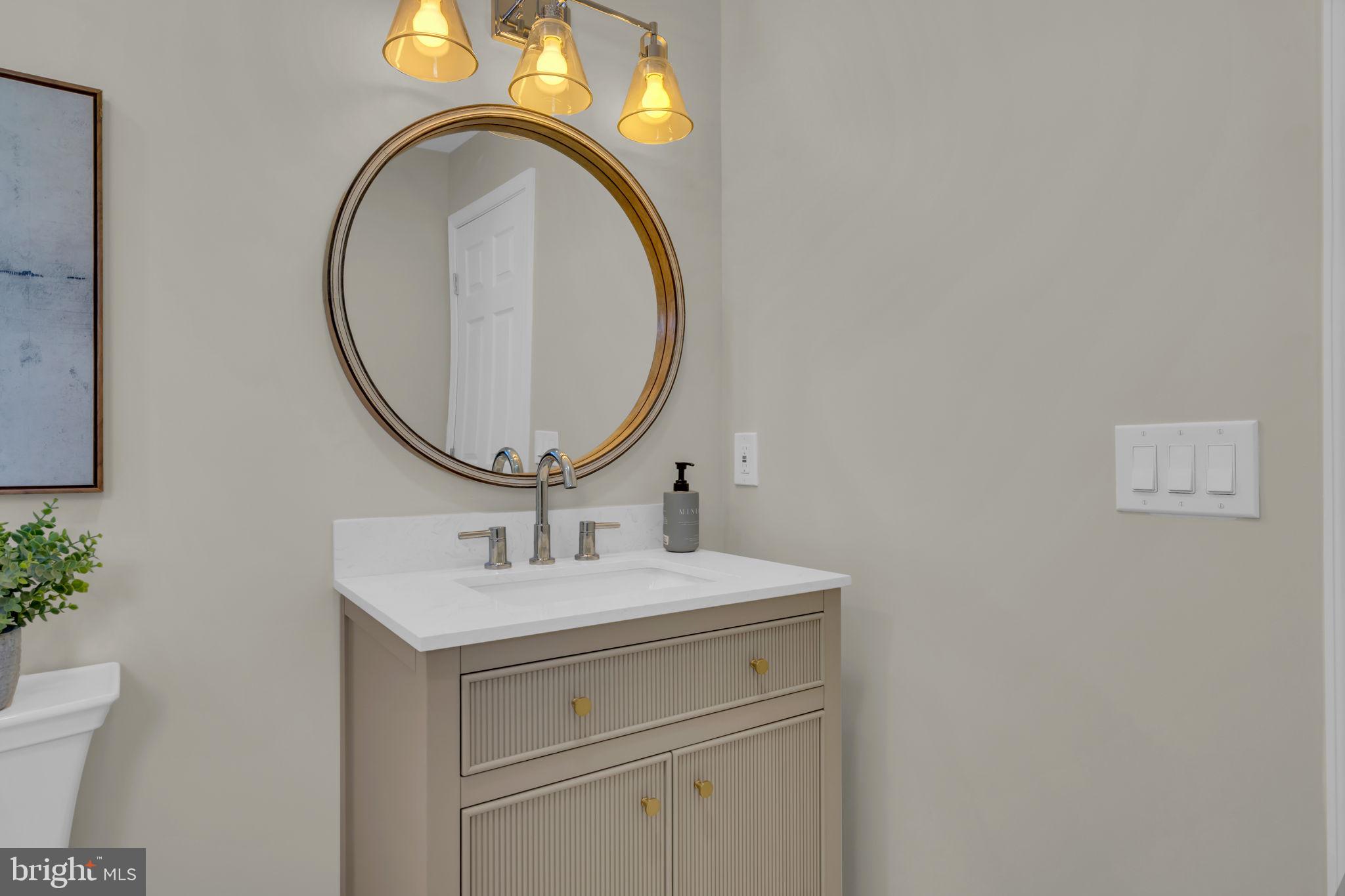 568 Flock Road Trenton, NJ 08690 - Photo 30 of 42 a bathroom with a sink and a mirror