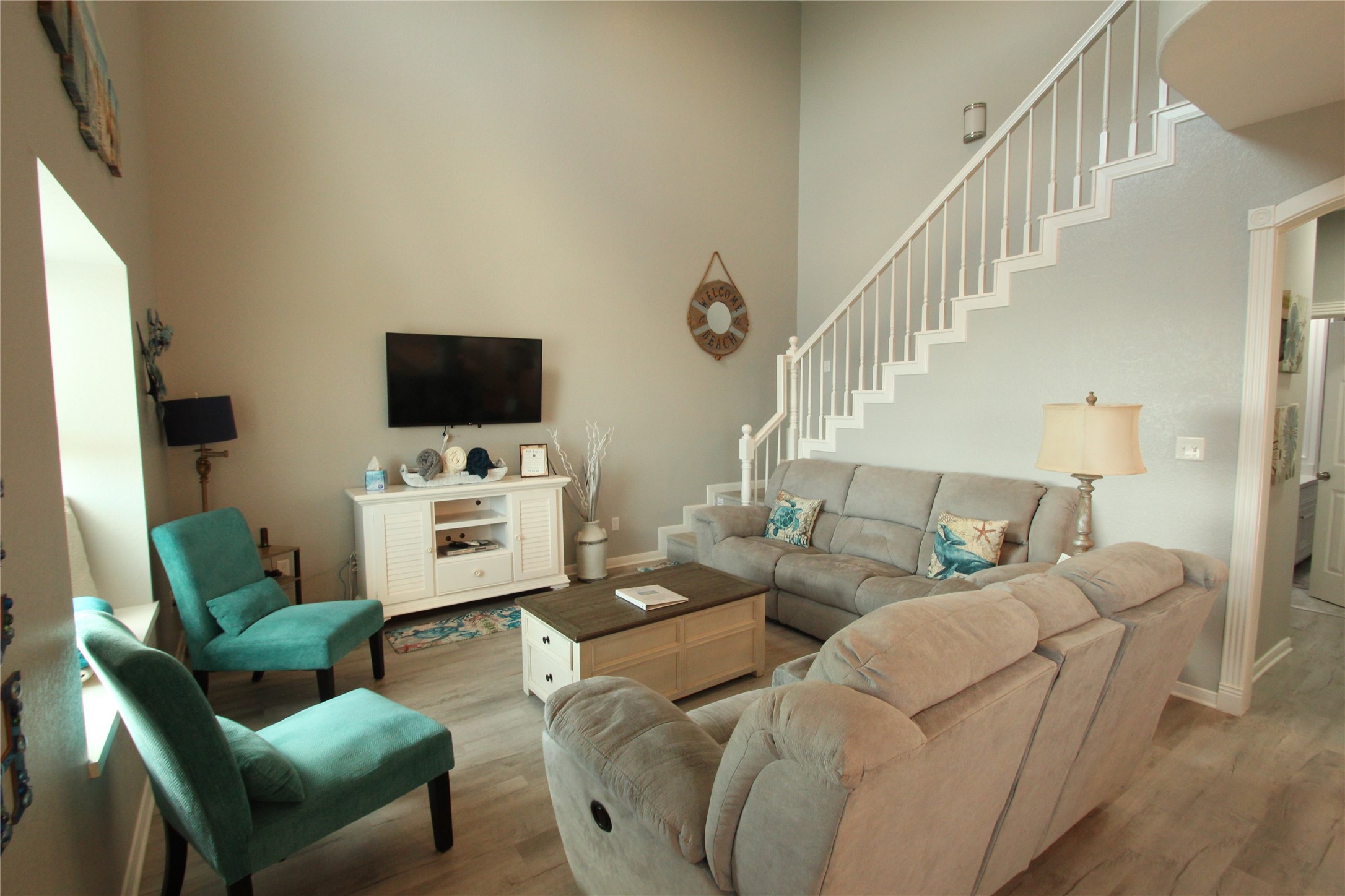 1648 Sandpebble Place Surfside Beach, TX 77541 - Photo 13 of 50 a living room with furniture a flat screen tv and a fireplace
