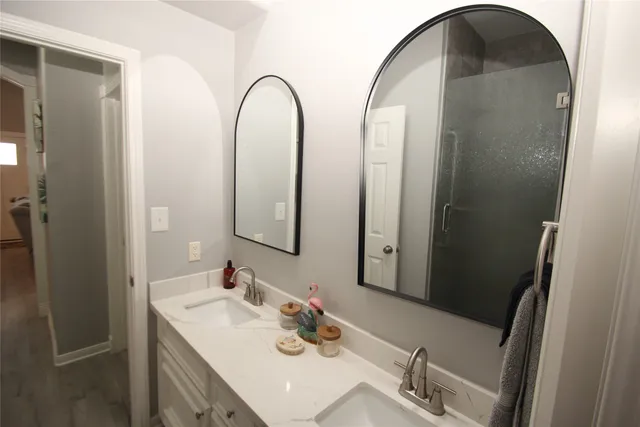 a view of a balcony with a floor to ceiling window with wooden floor