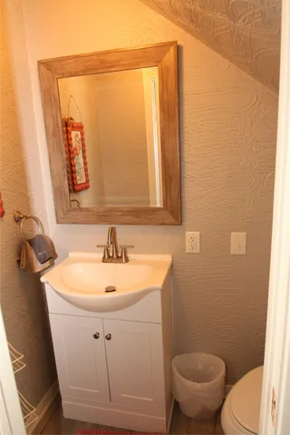 a view of a balcony with wooden floor