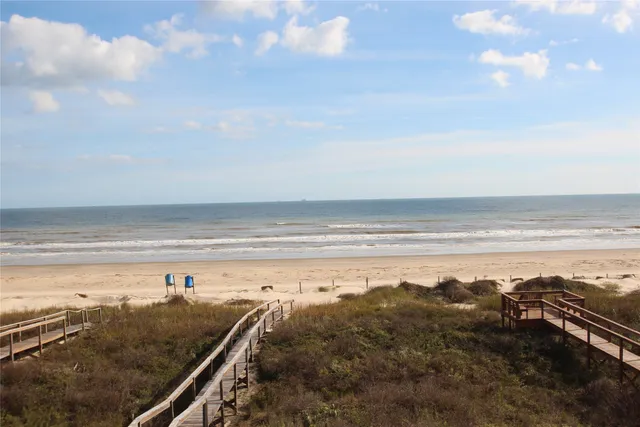a bathroom with double vanity sink and a mirror