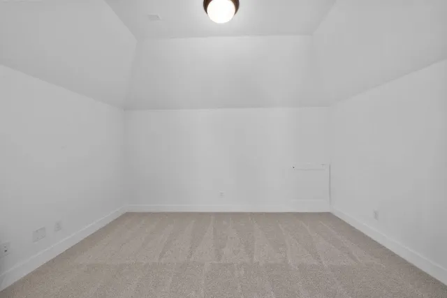 a view of a hallway with a ceiling fan