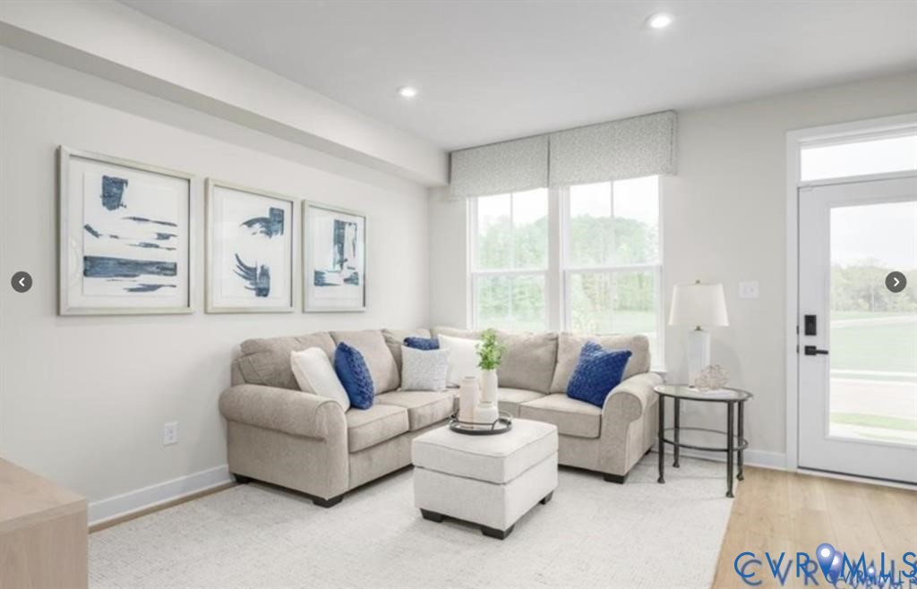 12743 Red Clover Way Midlothian, VA 23112 - Photo 21 of 26 a living room with furniture and a large window