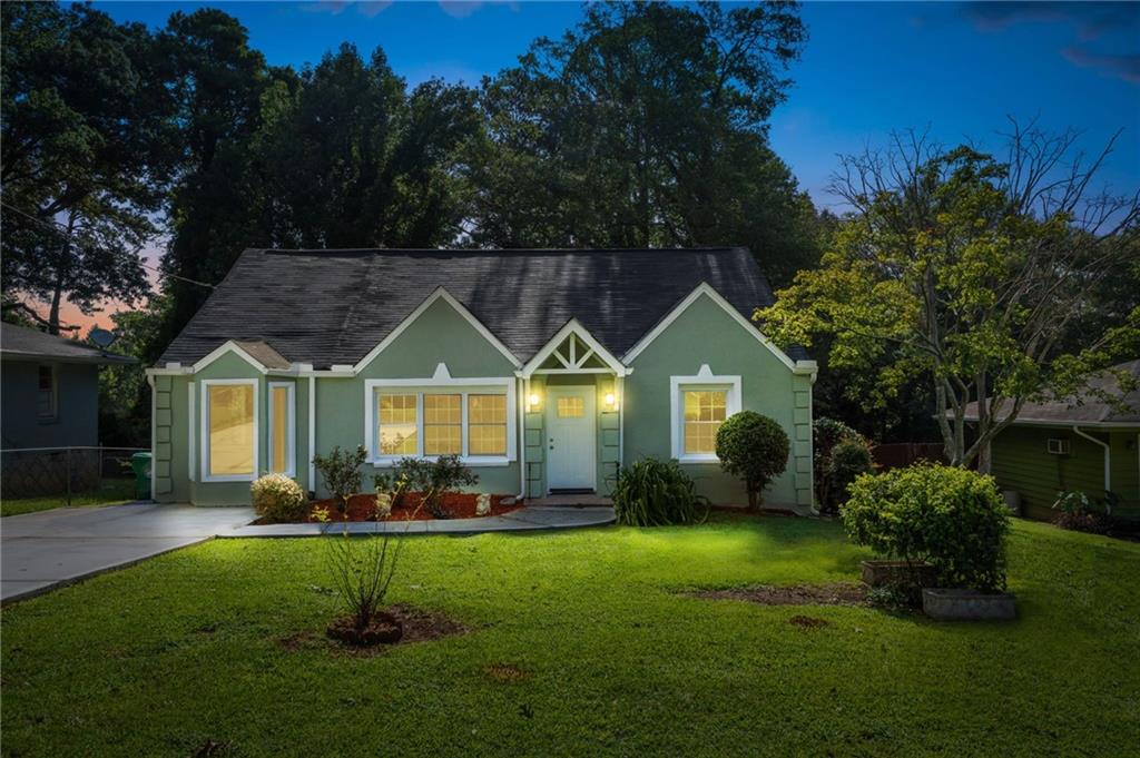 1920 Long Drive Decatur, GA 30032 - Photo 1 of 1 a front view of a house with garden