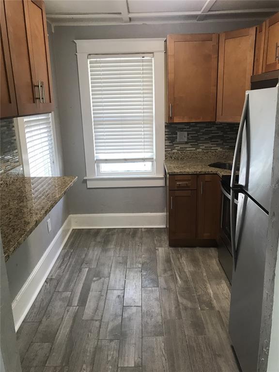 1952 Morrill Street, Unit B Sarasota, FL 34236 - Photo 5 of 12 a kitchen with a refrigerator and window