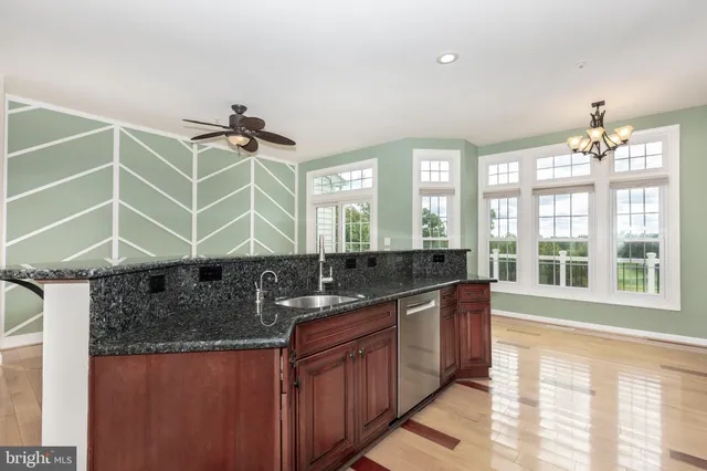 a bathroom with a sink and a large mirror