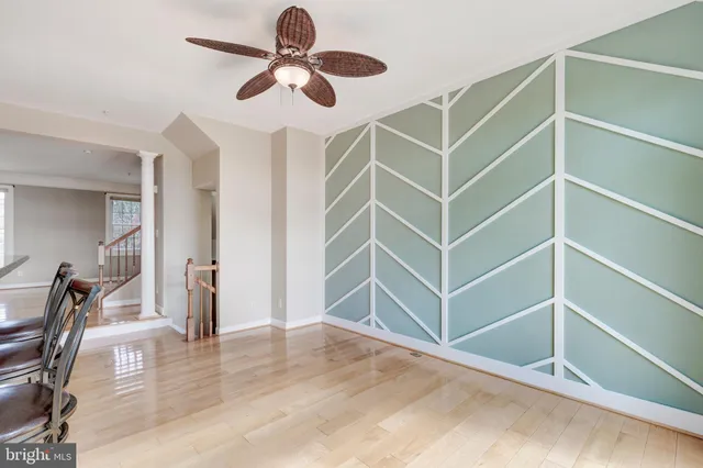 a view of a room with shelves and wooden floors