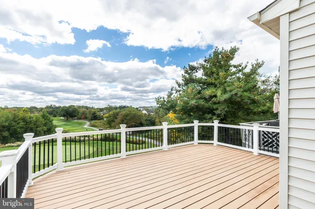a view of a balcony with wooden floor