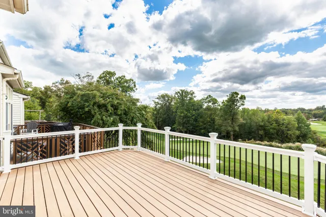 a view of a balcony with wooden floor