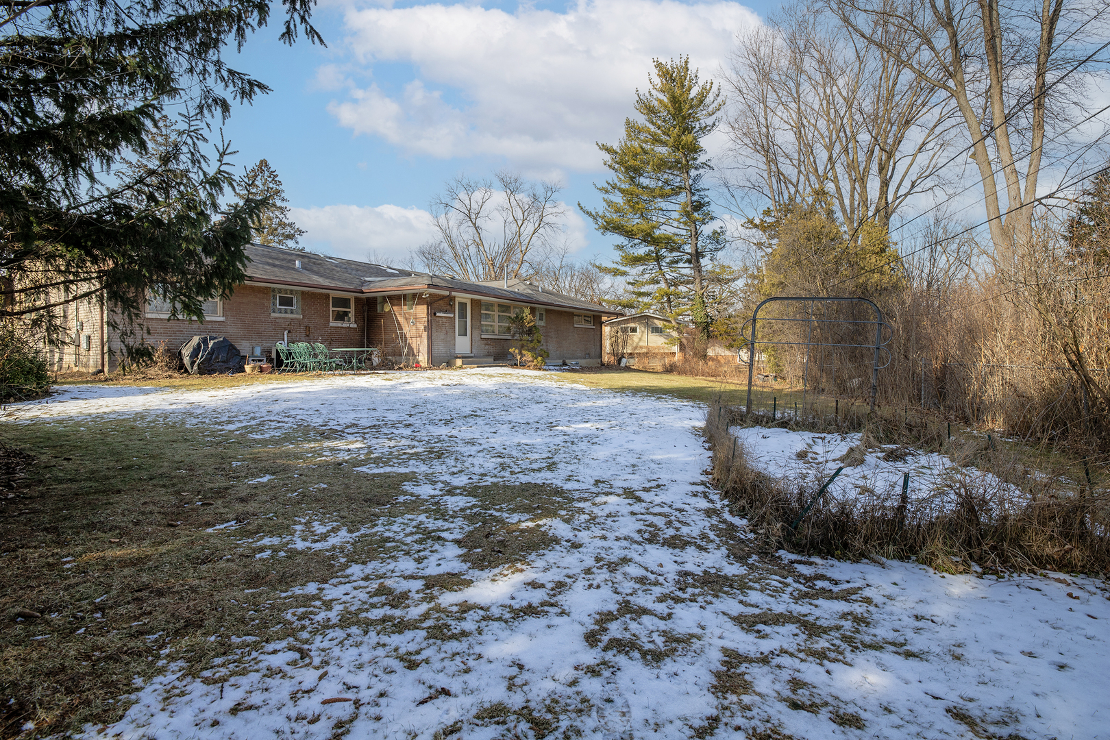 103 South Maple Lane Prospect Heights, IL 60070 - Photo 17 of 17 a front view of a house with a yard and trees