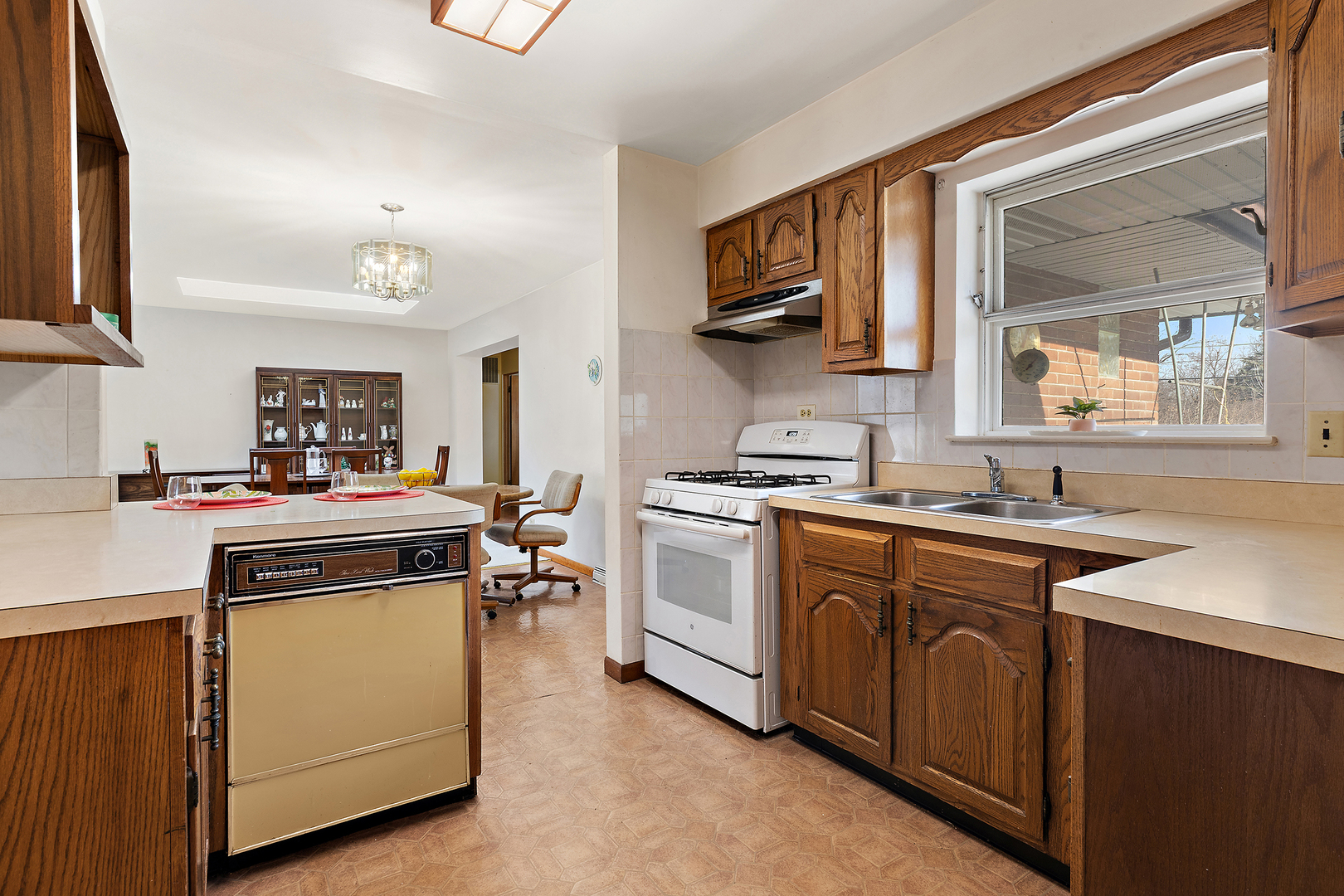 103 South Maple Lane Prospect Heights, IL 60070 - Photo 5 of 17 a kitchen with a stove top oven sink and cabinets