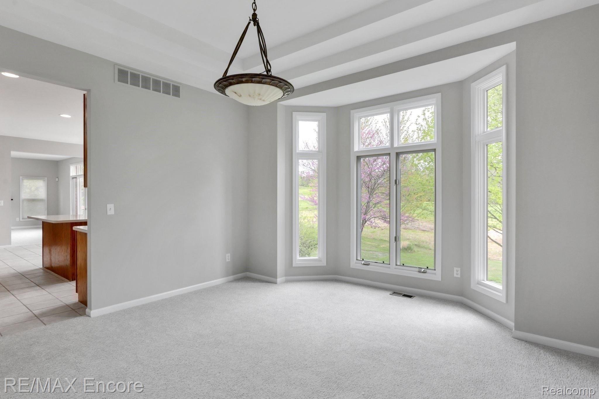 6791 Oakhurst Ridge Road Clarkston, MI 48348 - Photo 17 of 37 Tiered Ceiling Dining Room