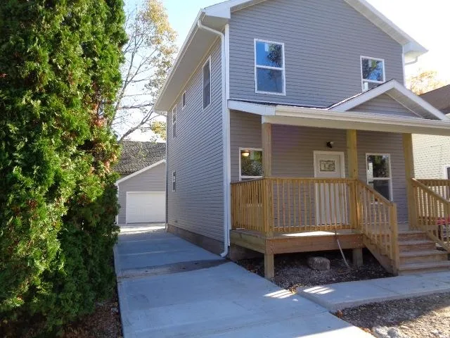 a view of porch with a bench