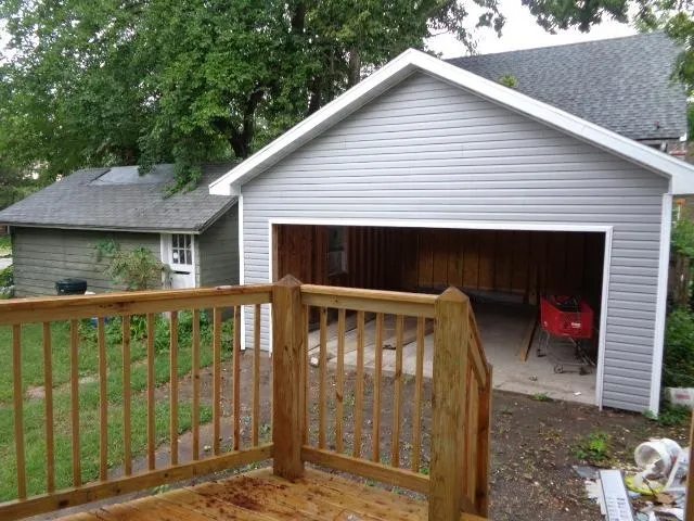 a view of a small house with roof yard