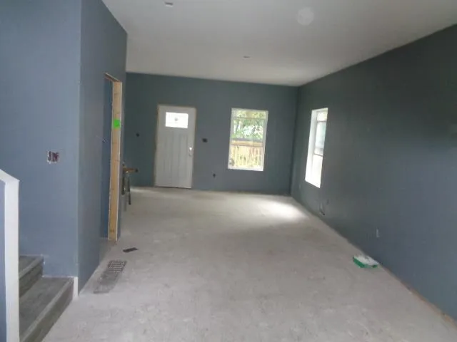 a view of livingroom with window and hardwood floor