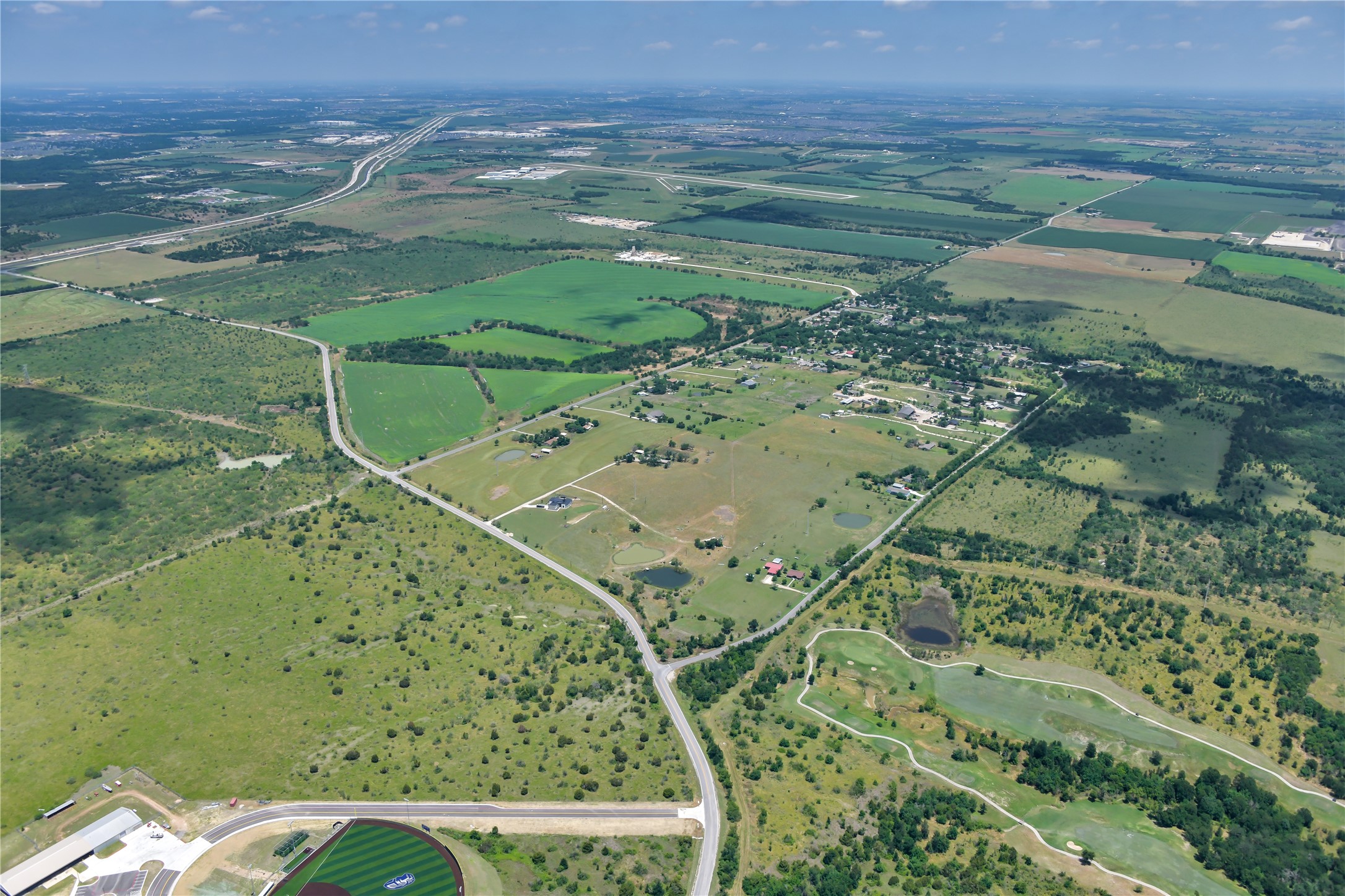 13245 Gregg Manor Road Manor, TX 78653 - Photo 7 of 12 a view of a field with an ocean view