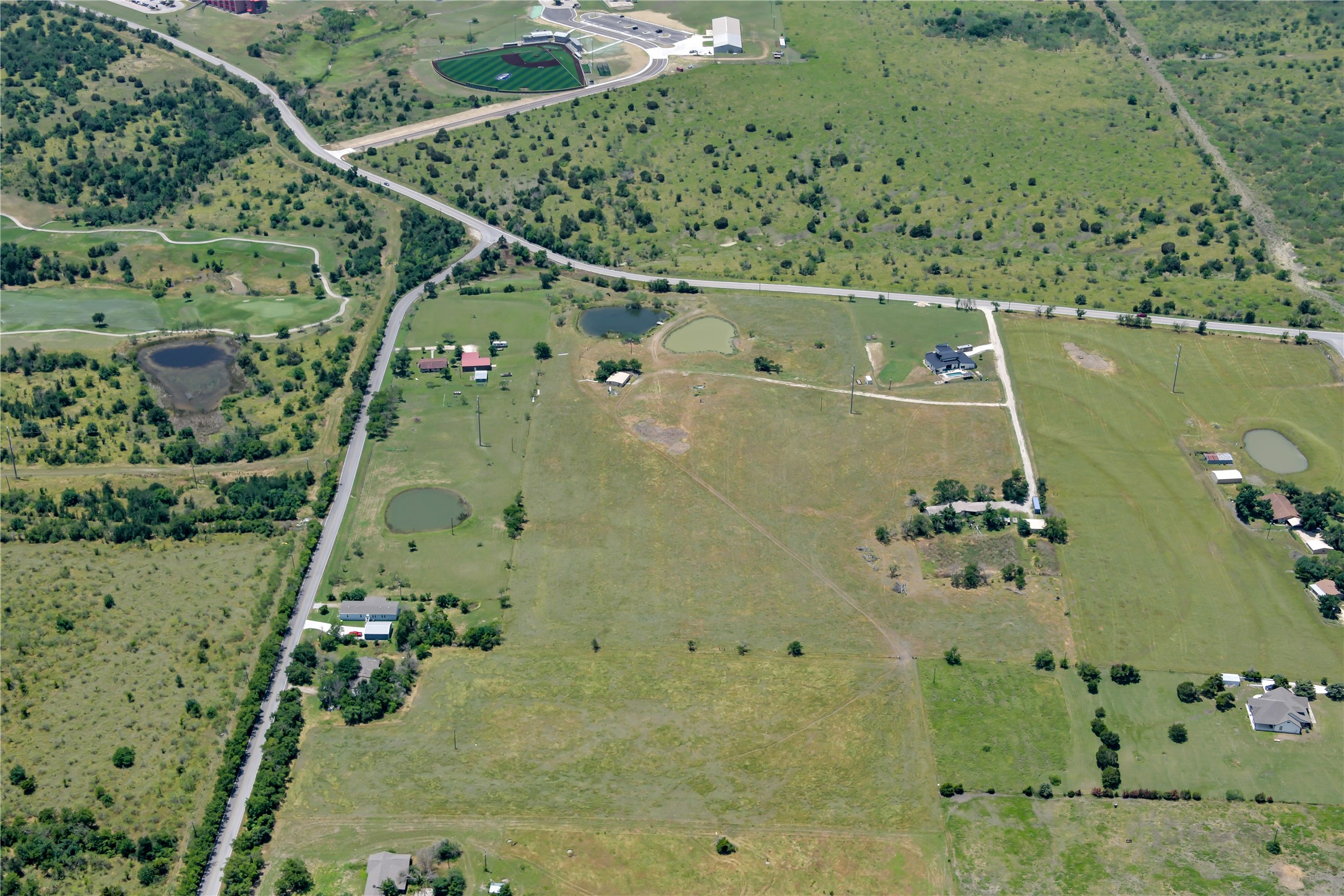13245 Gregg Manor Road Manor, TX 78653 - Photo 8 of 12 an aerial view of a residential houses with outdoor space