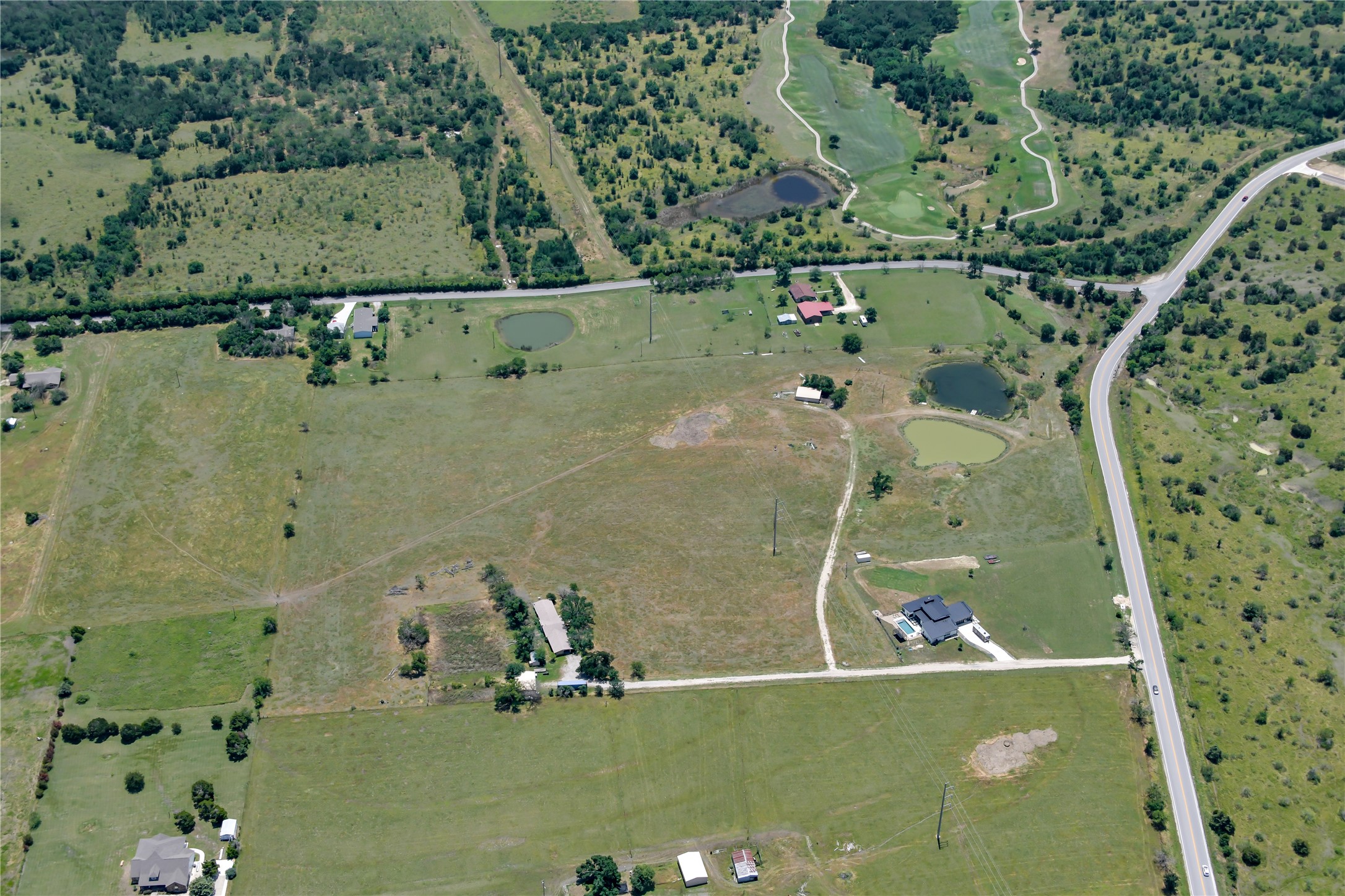 13245 Gregg Manor Road Manor, TX 78653 - Photo 9 of 12 an aerial view of a residential houses with outdoor space