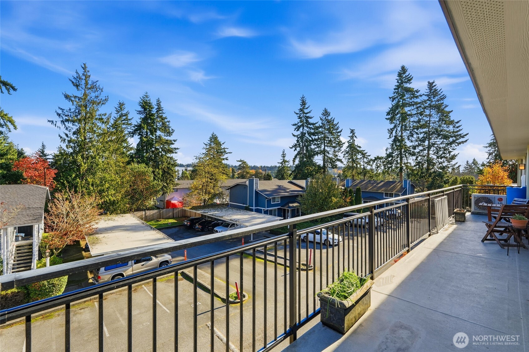 7503 212th Street Southwest, Unit B302 Edmonds, WA 98026 - Photo 18 of 28 a view of a balcony with wooden fence and floor