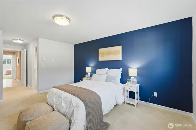 a bedroom with a bed and a night stand