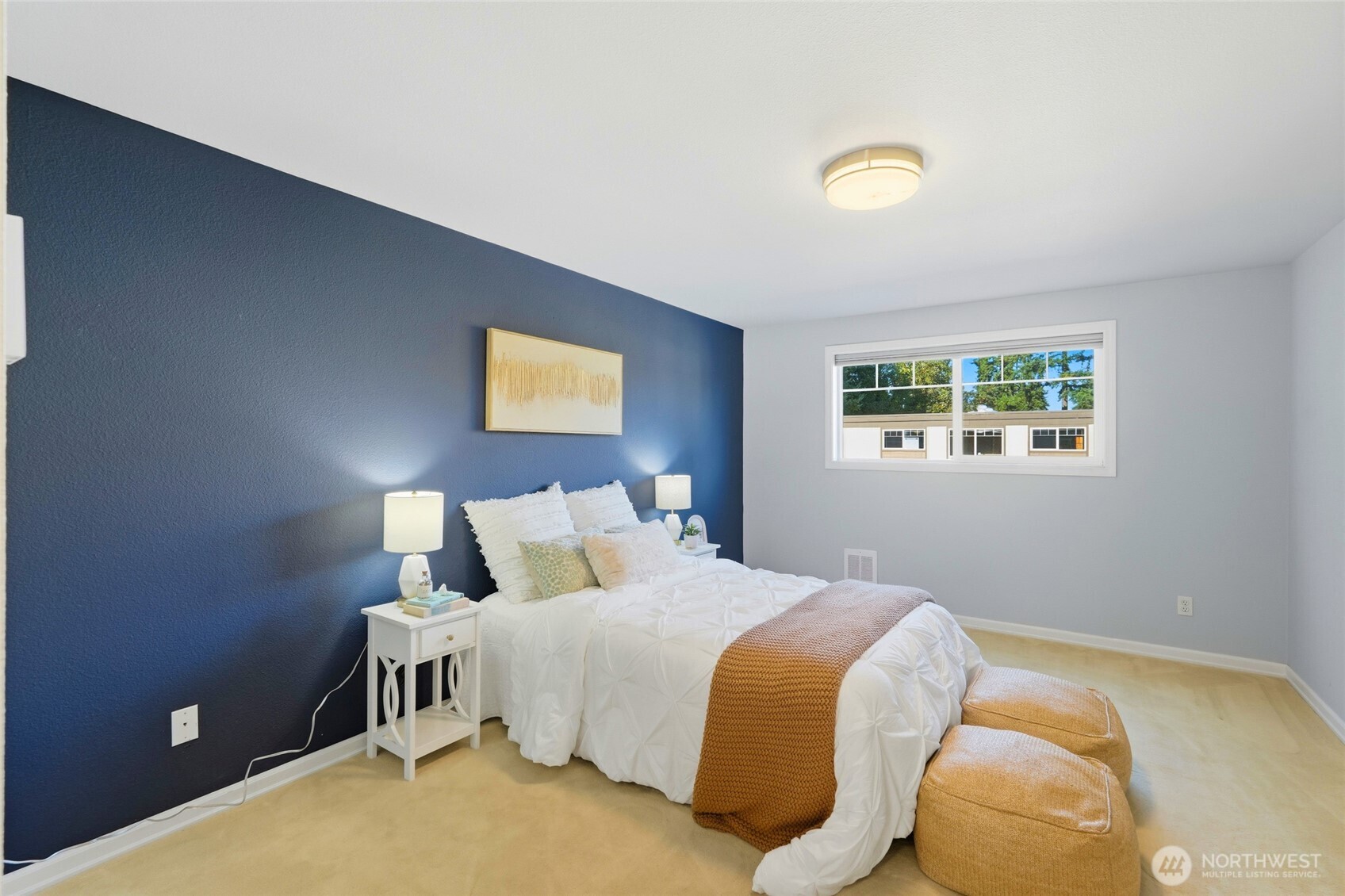 7503 212th Street Southwest, Unit B302 Edmonds, WA 98026 - Photo 20 of 28 a bedroom with a bed and a window