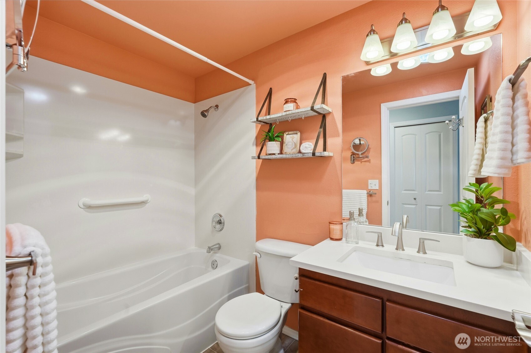 7503 212th Street Southwest, Unit B302 Edmonds, WA 98026 - Photo 21 of 28 a bathroom with a sink a toilet and shower