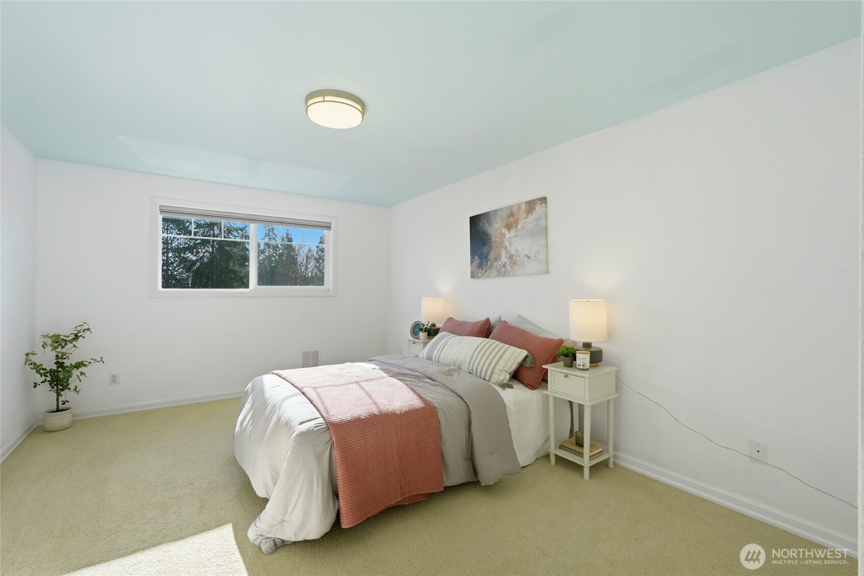 7503 212th Street Southwest, Unit B302 Edmonds, WA 98026 - Photo 22 of 28 a bedroom with a bed and painting on the wall