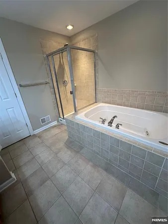 a view of storage and utility room with washer and dryer