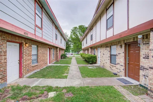 a view of a building with a yard