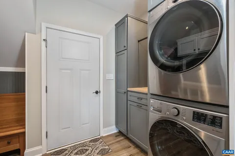 a view of living room with furniture and a rug