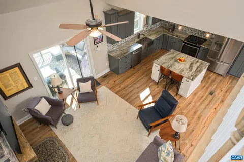 a bedroom with a bed and dresser with mirror