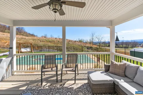a view of a balcony with chairs