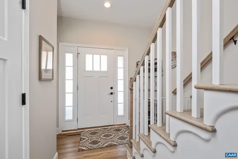 a view of a entryway with wooden floor