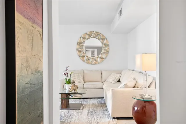 a living room with furniture or couch and a large window