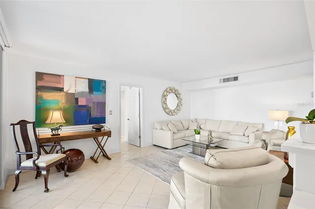 a kitchen with kitchen island a dining table and chairs