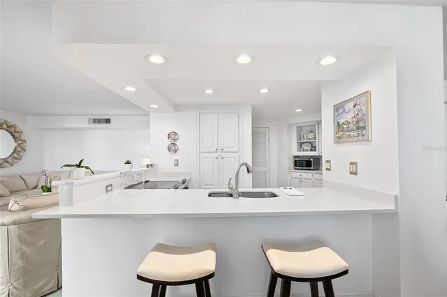 a kitchen with a sink and a stove