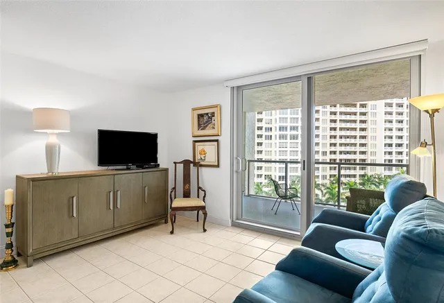 a bedroom with furniture and flat screen tv