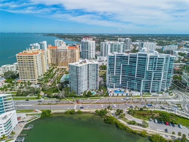 a view of a balcony with a yard