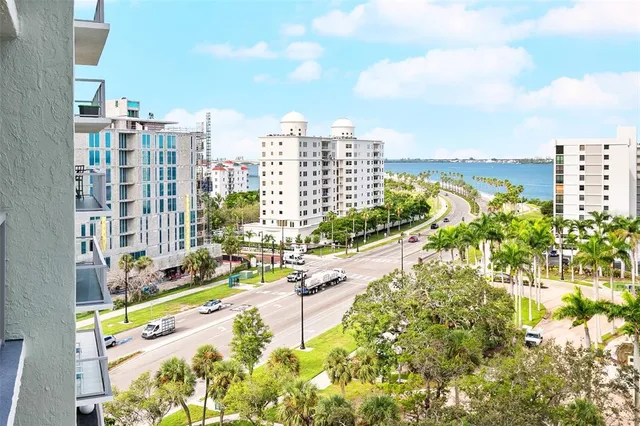 a view of front door with furniture and a window