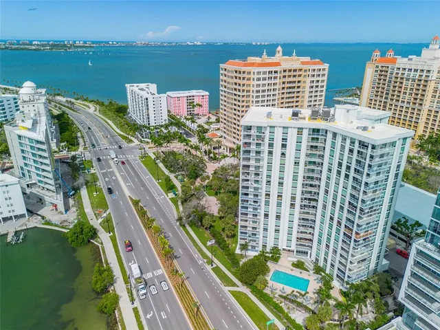 a view of building with outdoor space and lake view