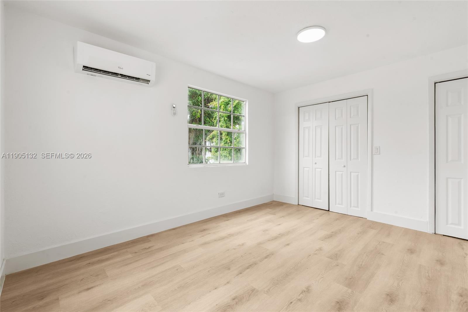2385 Southwest 17th Street Miami, FL 33145 - Photo 11 of 28 an empty room with windows