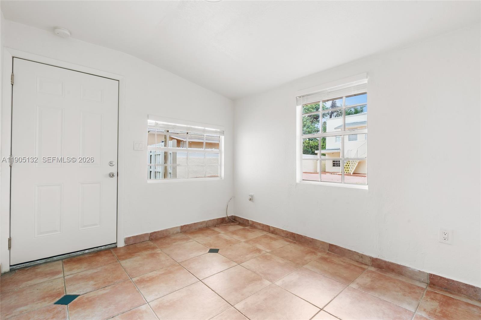 2385 Southwest 17th Street Miami, FL 33145 - Photo 15 of 28 a view of an empty room with a window