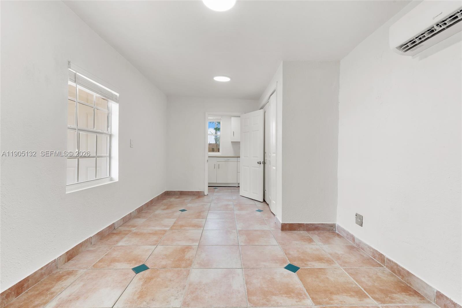 2385 Southwest 17th Street Miami, FL 33145 - Photo 19 of 28 a view of an empty room with a window