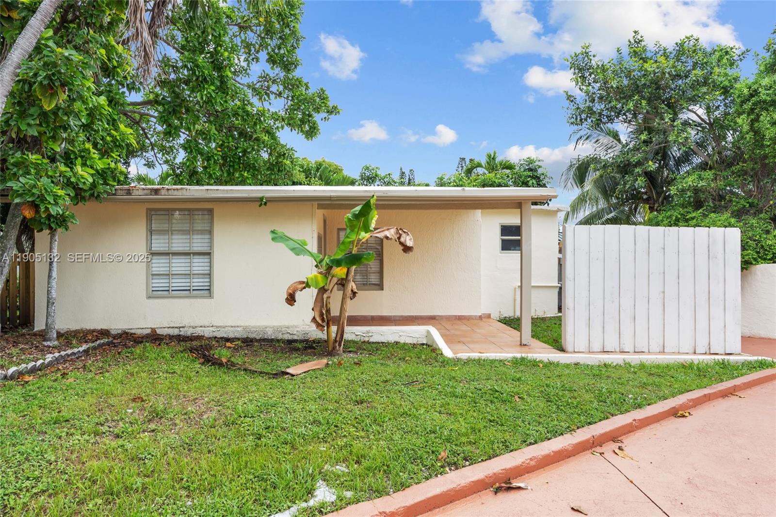 2385 Southwest 17th Street Miami, FL 33145 - Photo 26 of 28 a backyard of a house with a garden