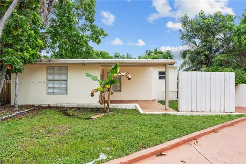a backyard of a house with a garden