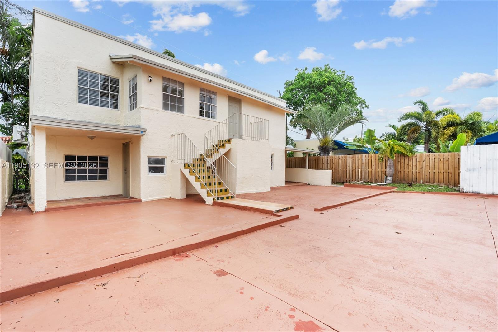 2385 Southwest 17th Street Miami, FL 33145 - Photo 4 of 28 a view of a house with a backyard and a garage