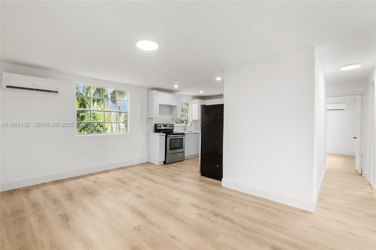 2385 Southwest 17th Street Miami, FL 33145 - Photo 6 of 28 a view of kitchen with window and refrigerator